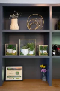Decorative shelves with books and small art pieces.