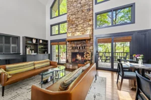 Modern living room with large windows and bar stools