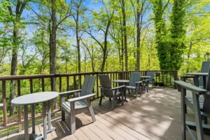 wooden deck with chairs and tables.
