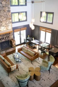 living room with fireplace and leather chairs.