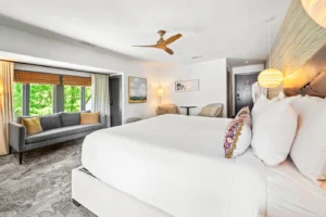 Woodland room with king bed, sitting area, and forest view.