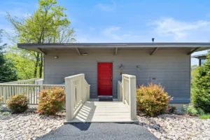 modern house with a red door.