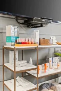 Spa products and nail polishes displayed on a shelf.