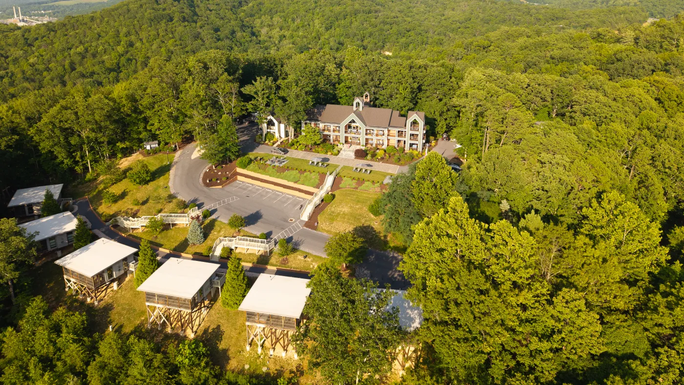 Aerial view of Iris Inn and Cabins surrounded by Shenandoah Valley forest near Waynesboro, Virginia.